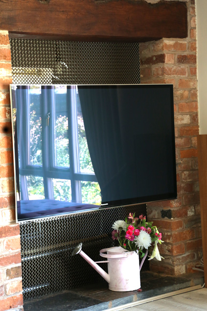 tv components hidden by mesh grille